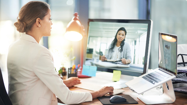 Female business person talking on a computer